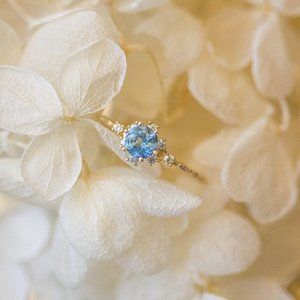 DAINTY GOLD PLATED RING WITH AQUAMARINE GEMSTONE
